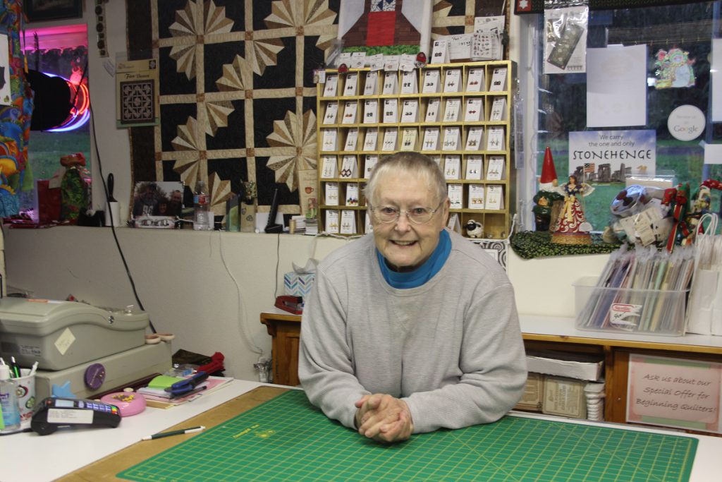 Quilt expert behind the counter in Cloverdale shop