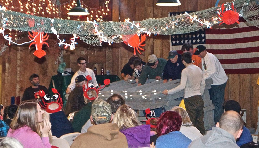 Crab racing, with audience looking on