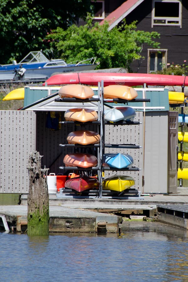 Kayaks stacked by the dock