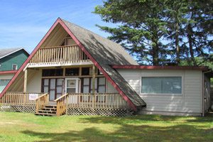 Beige house with giant slanted roof