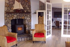 Sitting area with fireplace at Harborview Inn & RV Park