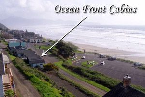 Big-picture view of beach and oceanfront cabins from above