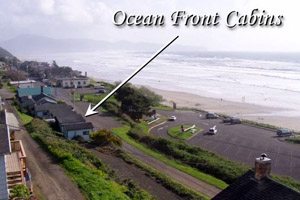 Big-picture view of beach and oceanfront cabins from above