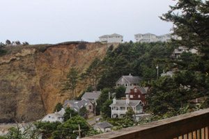 Houses on the side of a steep hill near the ocean