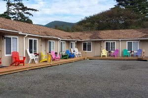 Colorful chairs on porches of motel rooms
