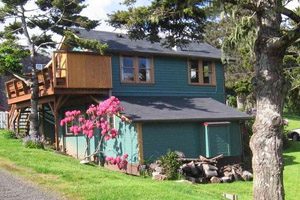 Blue two-story house with a yard