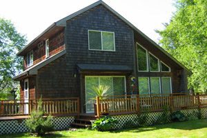 Big two-story house with large deck and yard