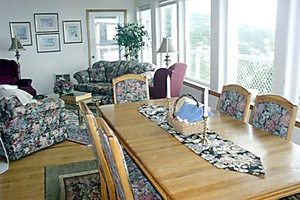Floral-upholstered living room and dining area