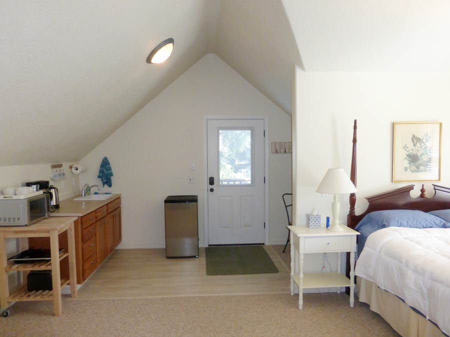 Bedroom and mini kitchen at Nedonna Beach Studio Retreat
