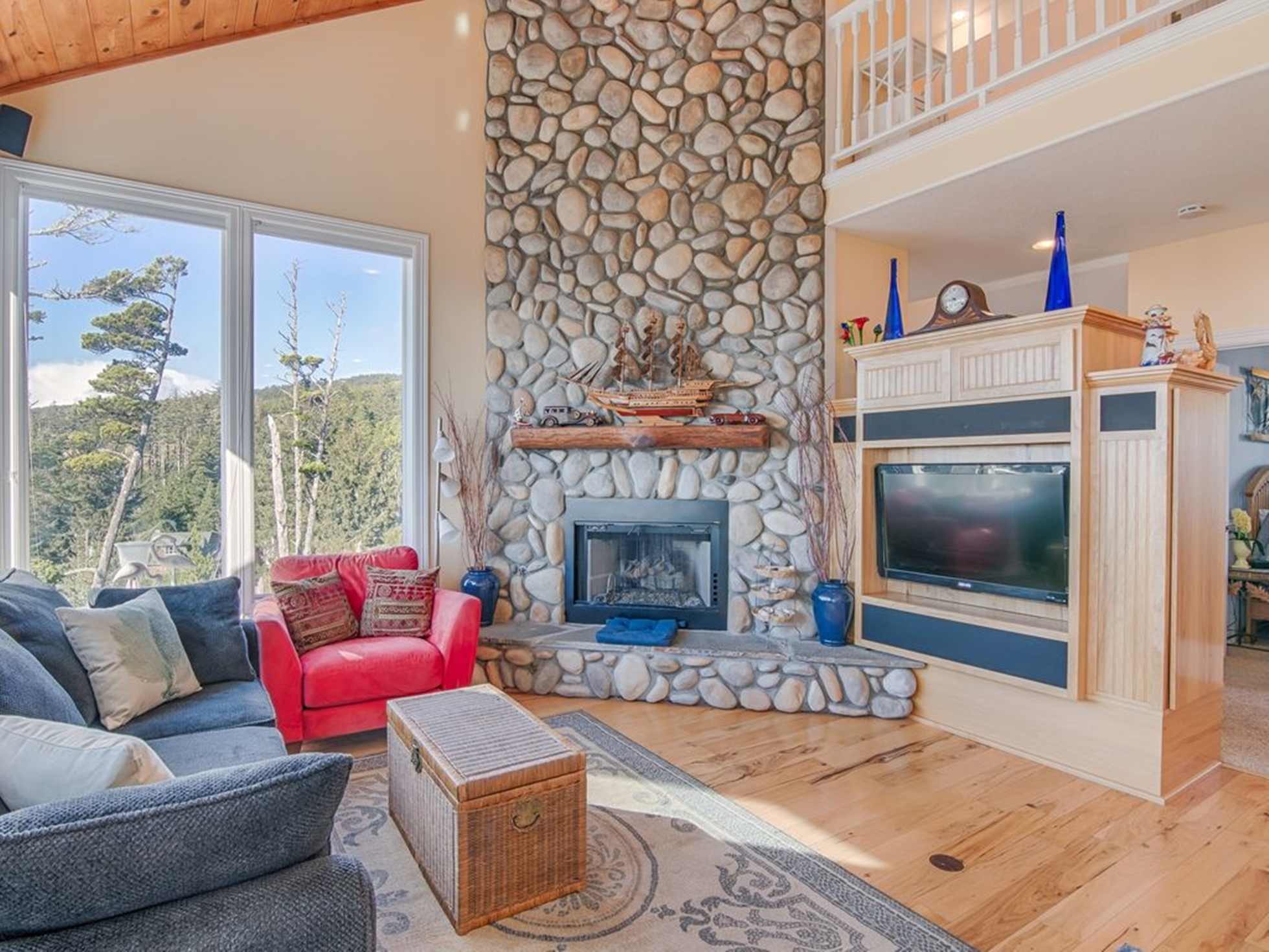 Modern living room with stone facade fireplace