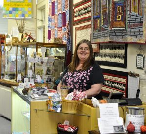 Latimer Quilt and Textile Center Associate Manager Kim Schauss is also a museum member. She takes classes at the center and welcomes guests cheerfully with both a cup of tea and talk