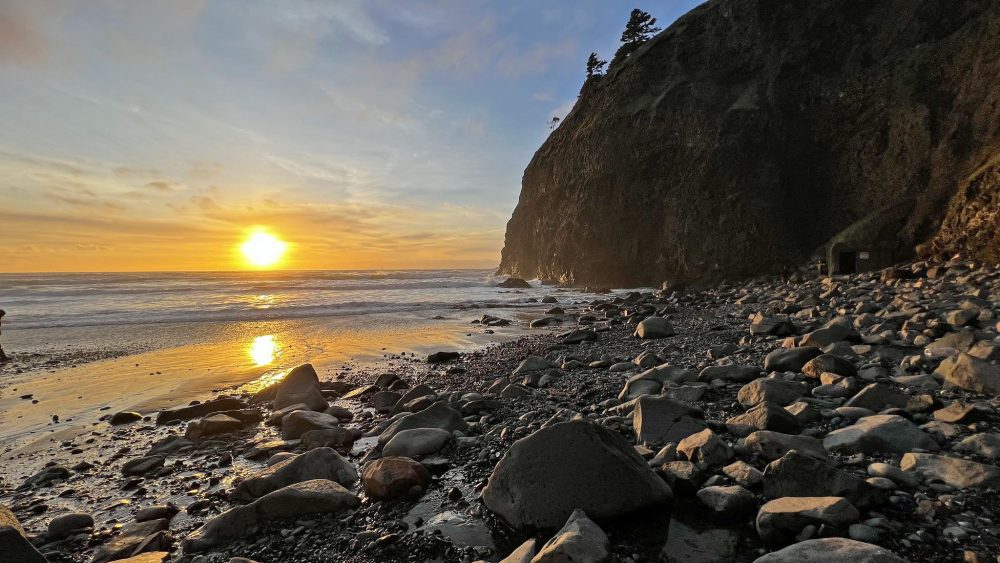 sunset rocky beach cliff