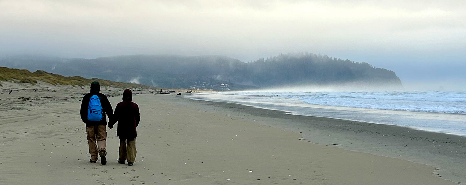 sandy beach hikers foggy